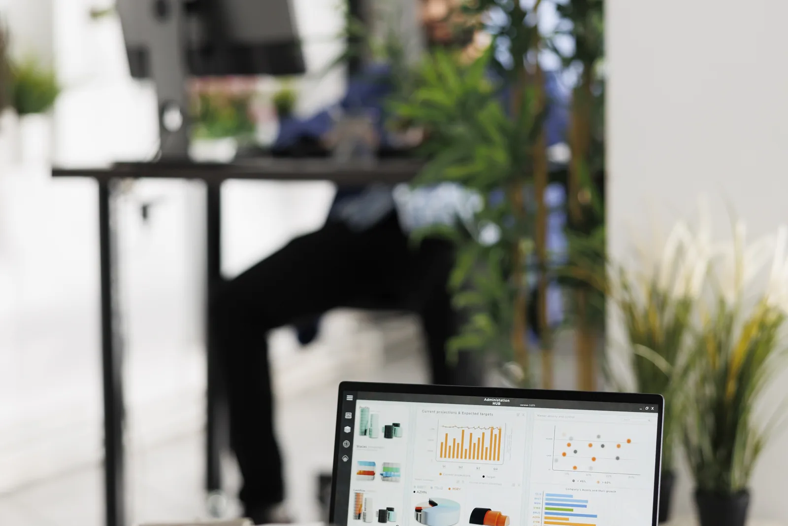 Reviewing model performance charts on a laptop